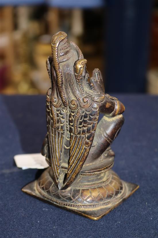 A Chinese celadon glazed tripod censer and a bronze figure of Garuda